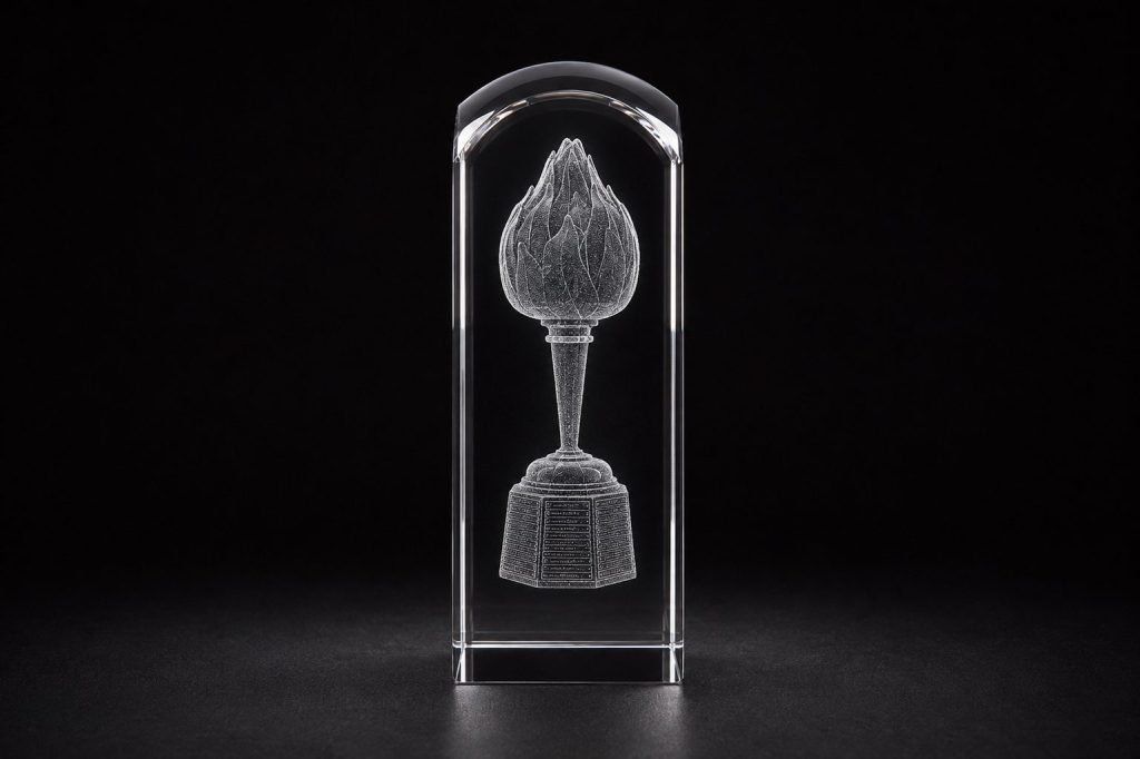 Crystal award product photograph featuring a clear faceted crystal tower with a refined 3D laser-engraved design suspended inside. The engraving depicts a detailed hart trophy form, rendered with smooth, high-density point cloud detailing for a seamless etched appearance. Set against a dramatic black background with subtle reflections and soft studio lighting that highlights the crystal’s polished edges and depth.