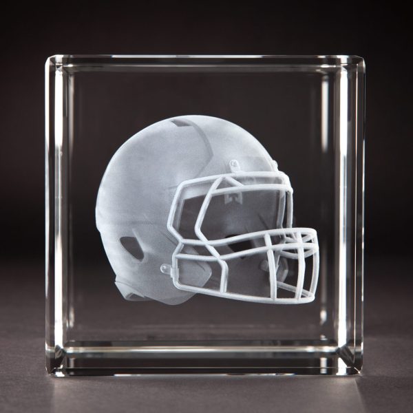 Crystal Sensations 3D laser engraved crystal cube featuring a detailed football helmet suspended inside optical crystal — custom sports crystal trophies by Crystal Sensations